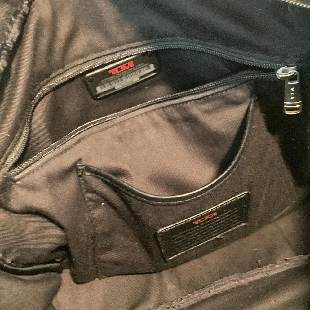 Tumi leather messenger tech lots of pockets